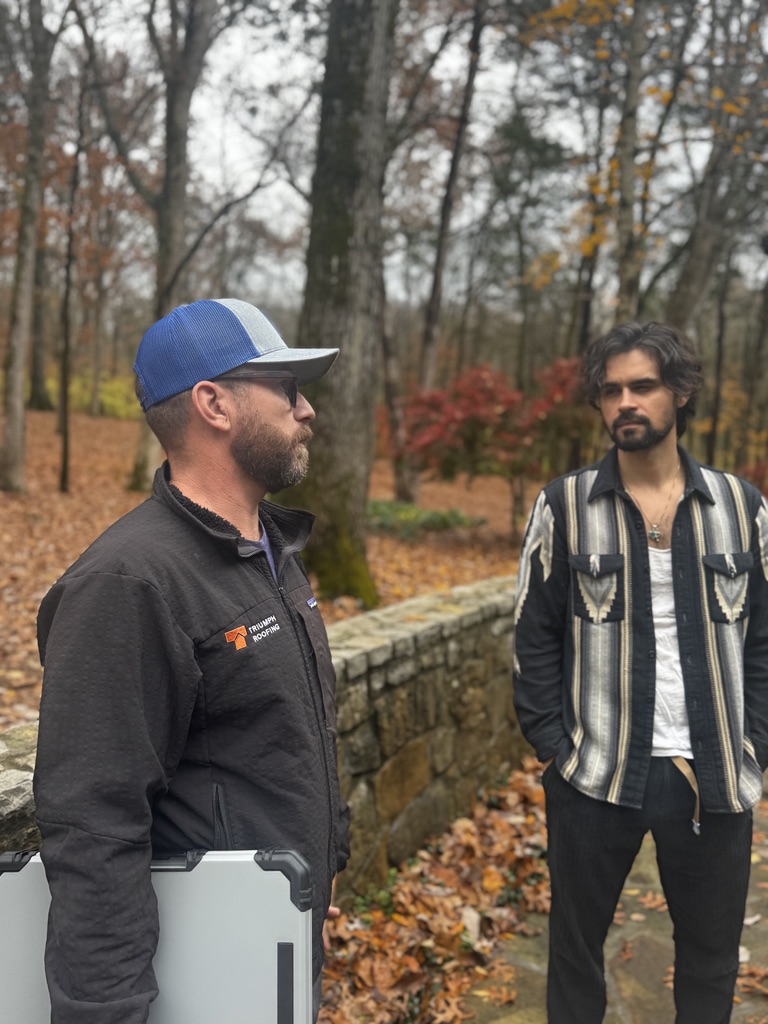 Triumph roof tech meeting with homeowner on-site